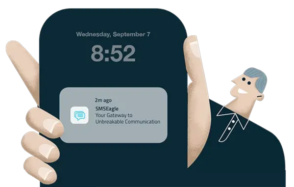 Person holding a dark blue rounded smartphone with a notification card visible on screen, showing time 8:52 and a message about SMS:Eagle: Your Gateway to Unbreakable Communication.