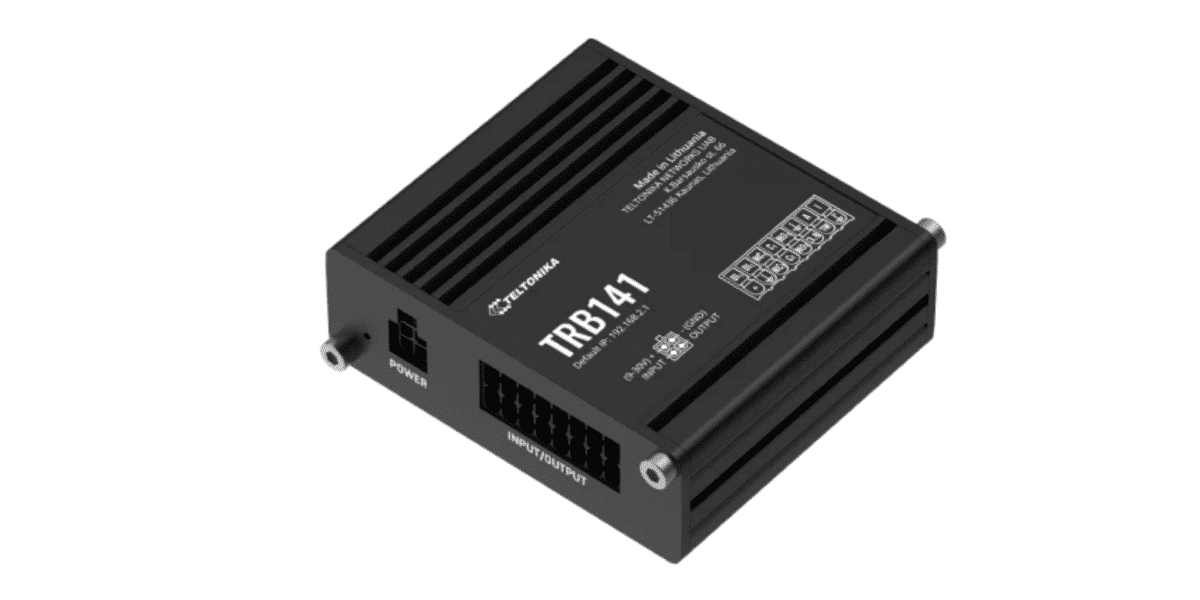 TRB141 black industrial module with a power jack on the left and a multi-pin front connector, labeled TRB141 on a ribbed metal body.
